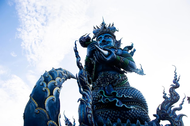 Wat Rong Seur Ten or artistic blue temple for thai people foreign travelers travel visit and respect praying blessing with holy mystery worship at Chiangrai city on July 1 2022 in Chiang Rai Thailand