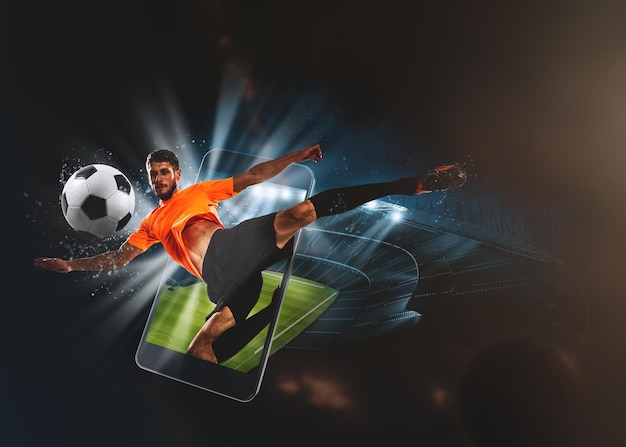 サッカーの試合に賭けるモバイルデバイスでスポーツの生中継を見る