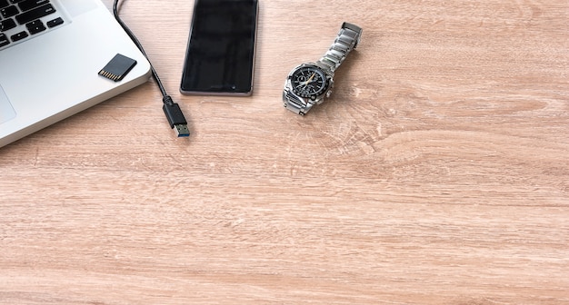 Watch, mobile laptop on Table