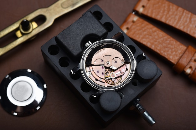 Watch repair, Vintage wrist watch overhaul and service checking mechanical movement by watchmaker.