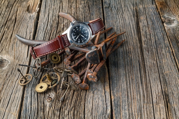 Watch and rusty tools