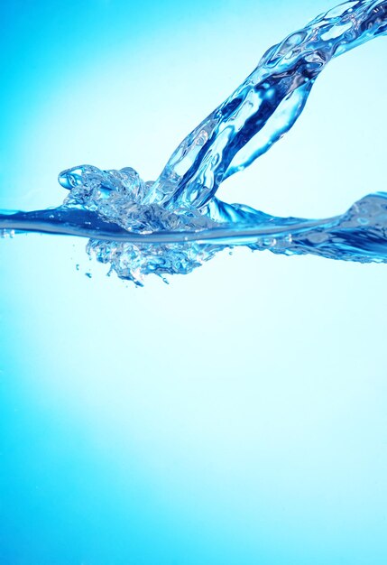 Water and air bubbles over light blue background