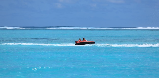 water attraction, riding on an inflatable sofa