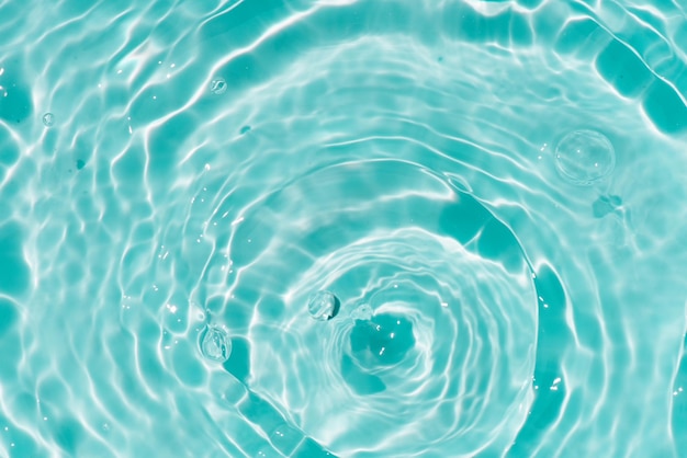 Water in a blue pool with a circle of water