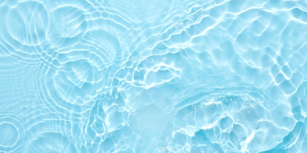 Water blue surface abstract background Waves and ripples of cosmetic moisturizer with bubbles