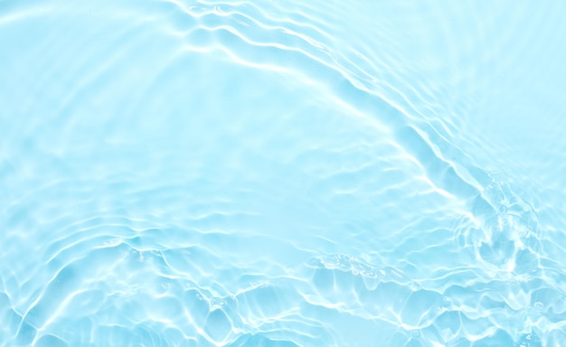 Water blue surface abstract background Waves and ripples of cosmetic moisturizer with bubbles