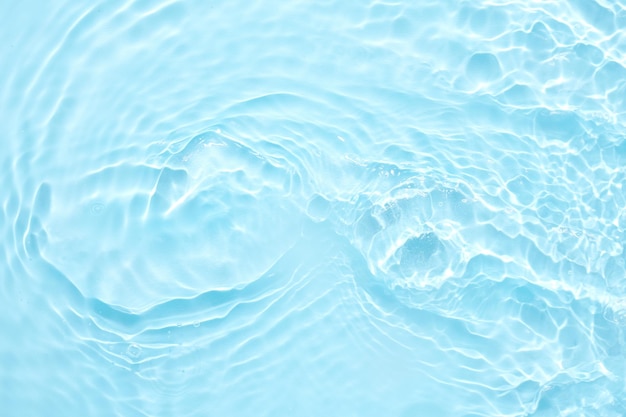 Water blue surface abstract background Waves and ripples of cosmetic moisturizer with bubbles