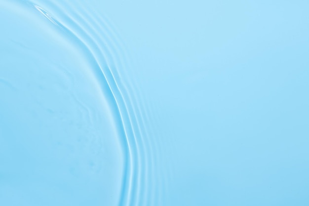 Water blue surface abstract background Waves and ripples texture of cosmetic aqua moisturizer with bubbles