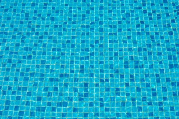 Photo water in a blue swimming pool, background