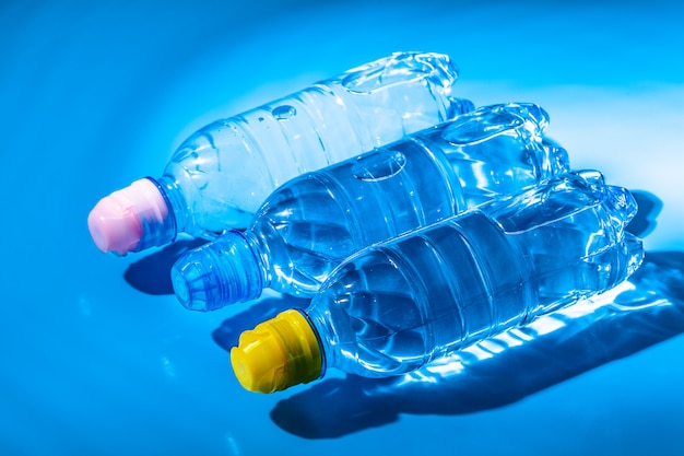 Water bottle close up on blue background