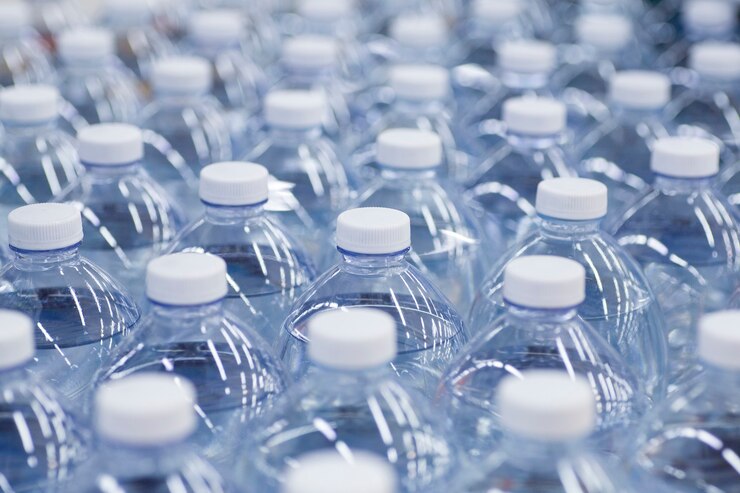 Water bottles in the supermarket packages of clean drinking water in plastic bottles