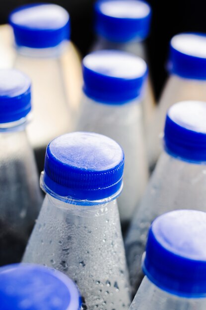 Water bottles with blue cups