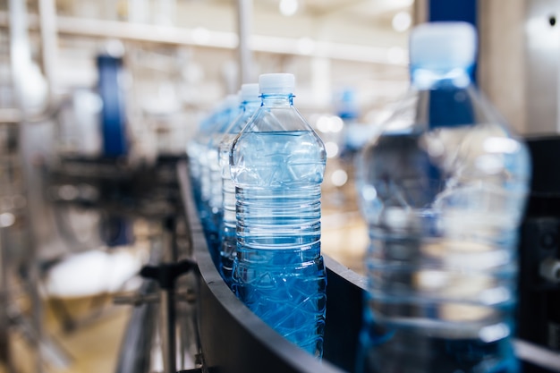 Water bottling line for processing and bottling carbonated water into blue bottles