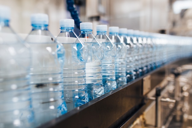 Water bottling line for processing and bottling pure spring water into blue bottles