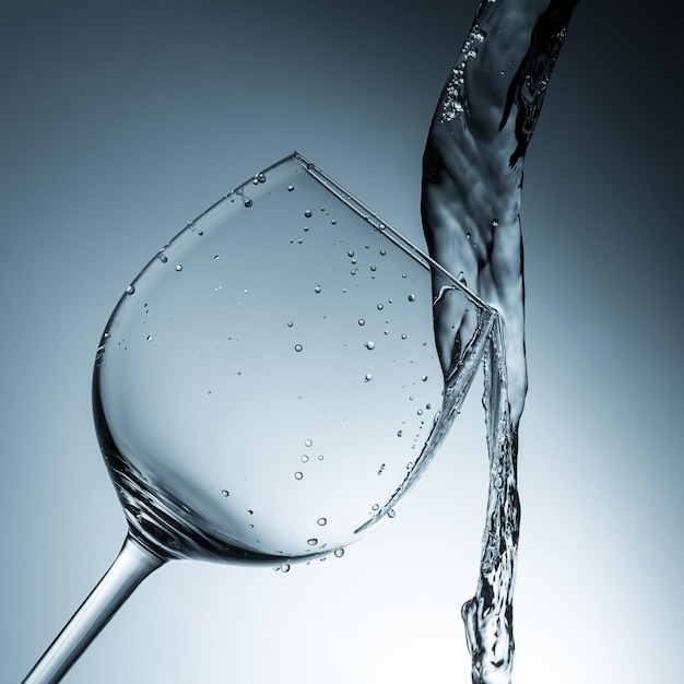 Water collides with a wineglass