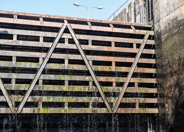 Water dripping from the lock gates of the Carrapatelo dam on River Douro as the level in the dock goes down