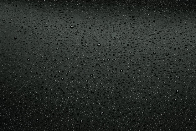 Photo water droplets on black background