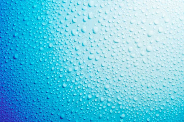 Water droplets on blue background