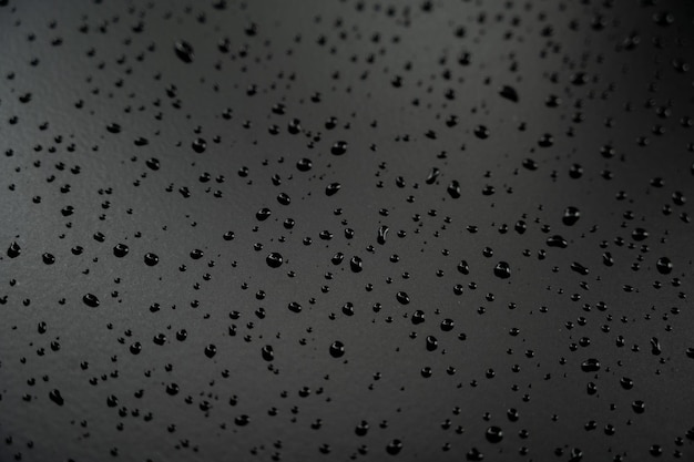 Water droplets on the floor with black background