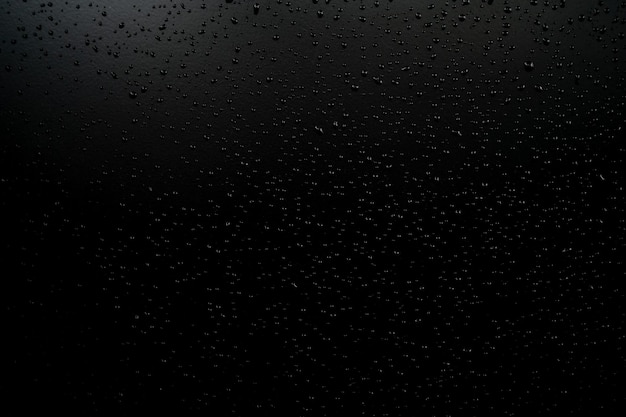 Water droplets on the floor with black background