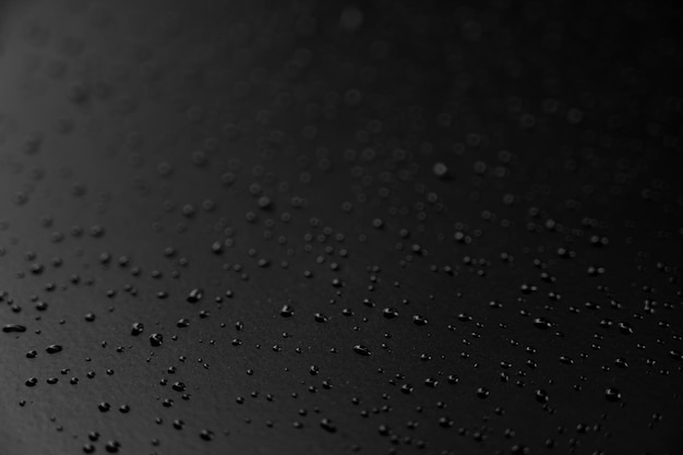 Water droplets on the floor with black background