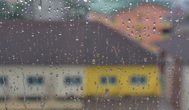 The water droplets on the glass are raindrops