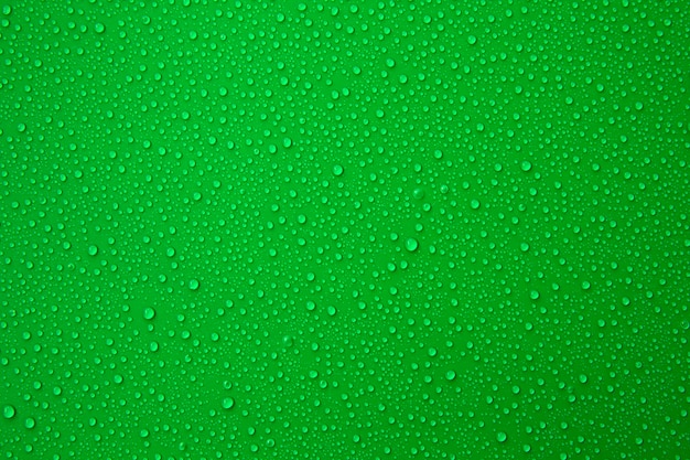 Water droplets on the green background for cool and fresh texture.