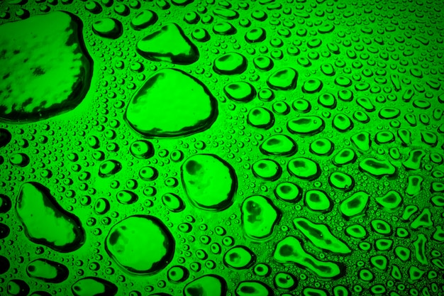 Water droplets on green metal a beautiful unusual texture