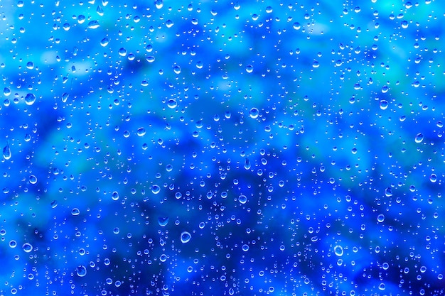 Water drops on abstract blue background texture