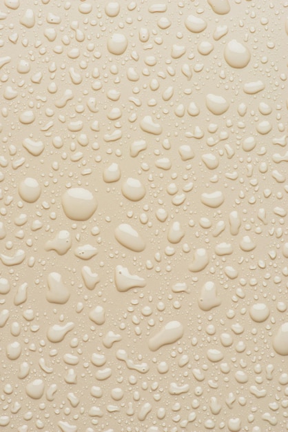 Water drops on a beige background