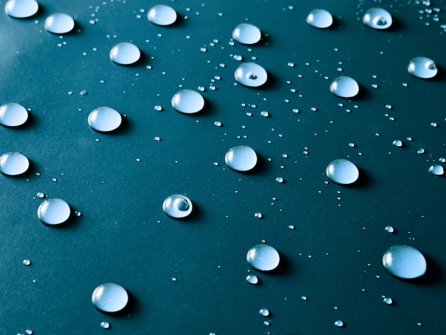 Photo water drops on blue background.