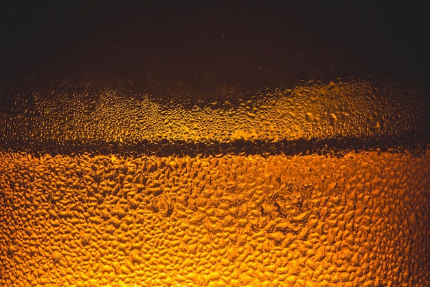 Water drops on glass of beer Close up beer background