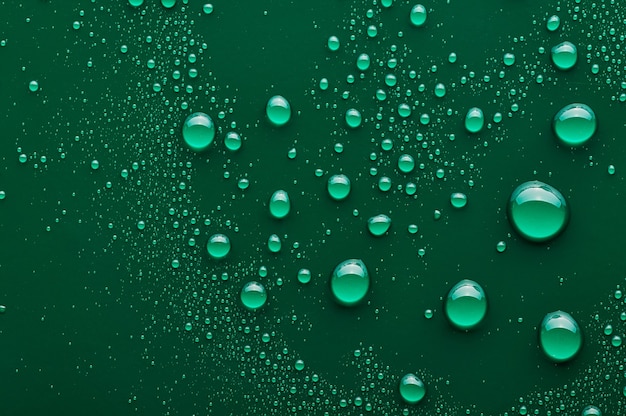 Water drops on a green background