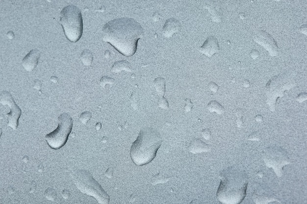 Water drops on the grey surface