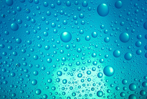 Фото Капли воды на синем фоне