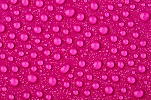 Photo water drops on a pink background