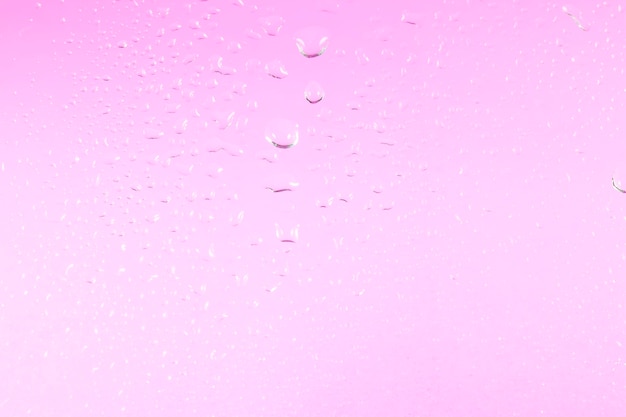 Water drops on purple background.