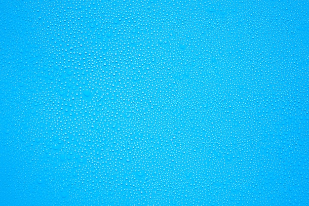 Water drops or rain drops on blue plastic sheet background