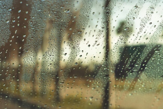 Water drops on vehicle window on rainy day