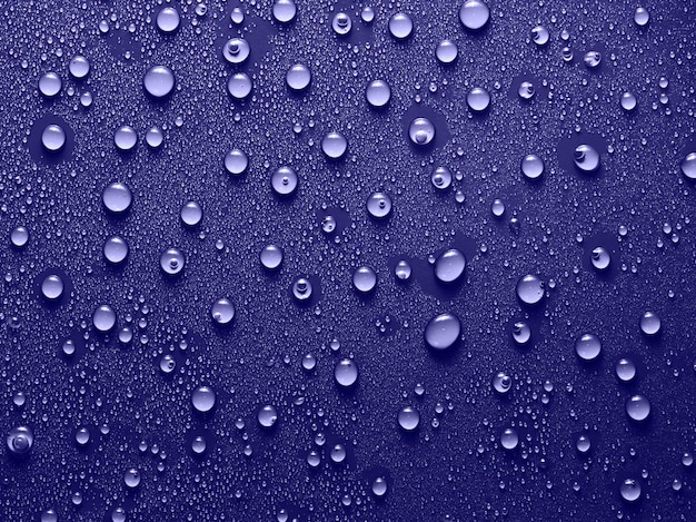 Water drops on very peri background Very Peri trend color 2022