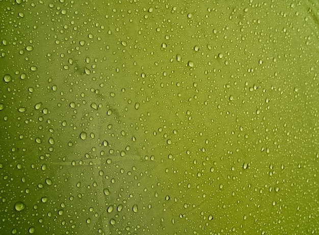 Water drops on waterproof membrane fabric. Morning dew on tent.