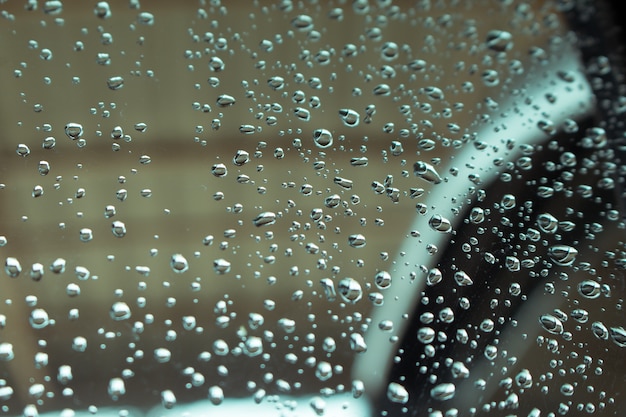 Foto gocce d'acqua sullo sfondo di vetro di finestra.