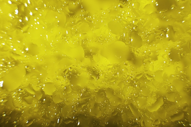 Water drops on a yellow background