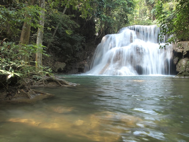 Water fall in spring season located in deep rain forest jungle