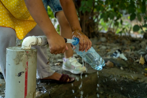 A water filling from the pipe to bottle