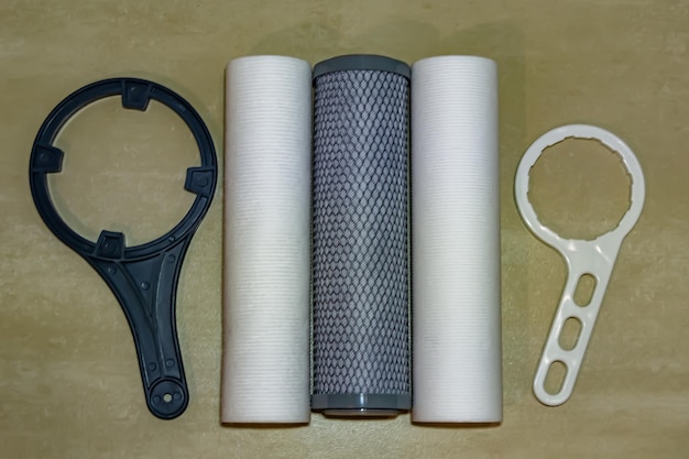 Water filter cartridge for home on background kitchen