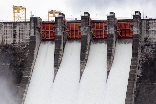 Water flowing over floodgates of a dam at Khun Dan Prakan Chon Nakhon Nayok Province Thailand