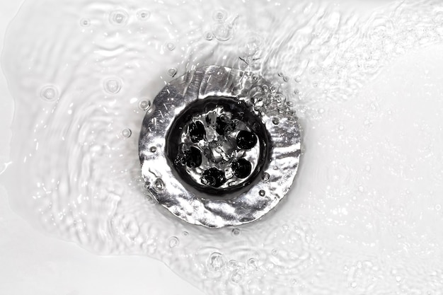 Water flows into a white sink