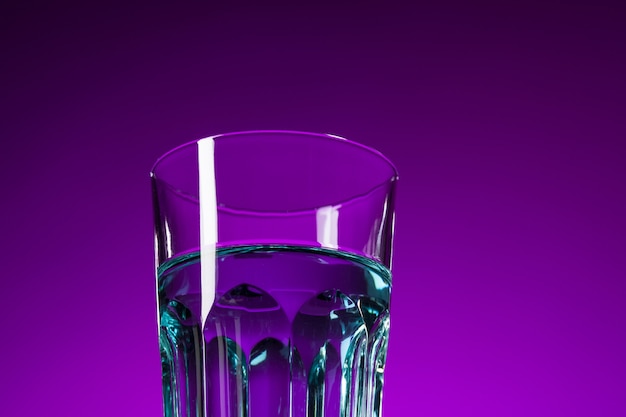 The water in glass on lilac