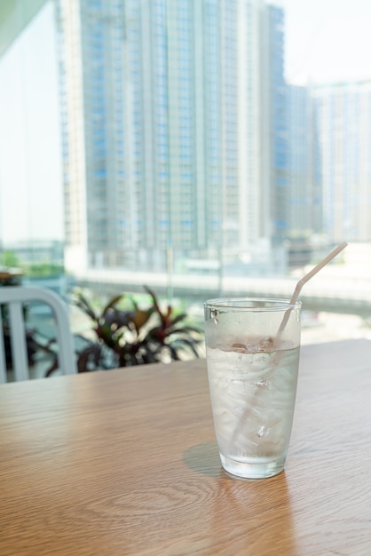 water glass with ice on table